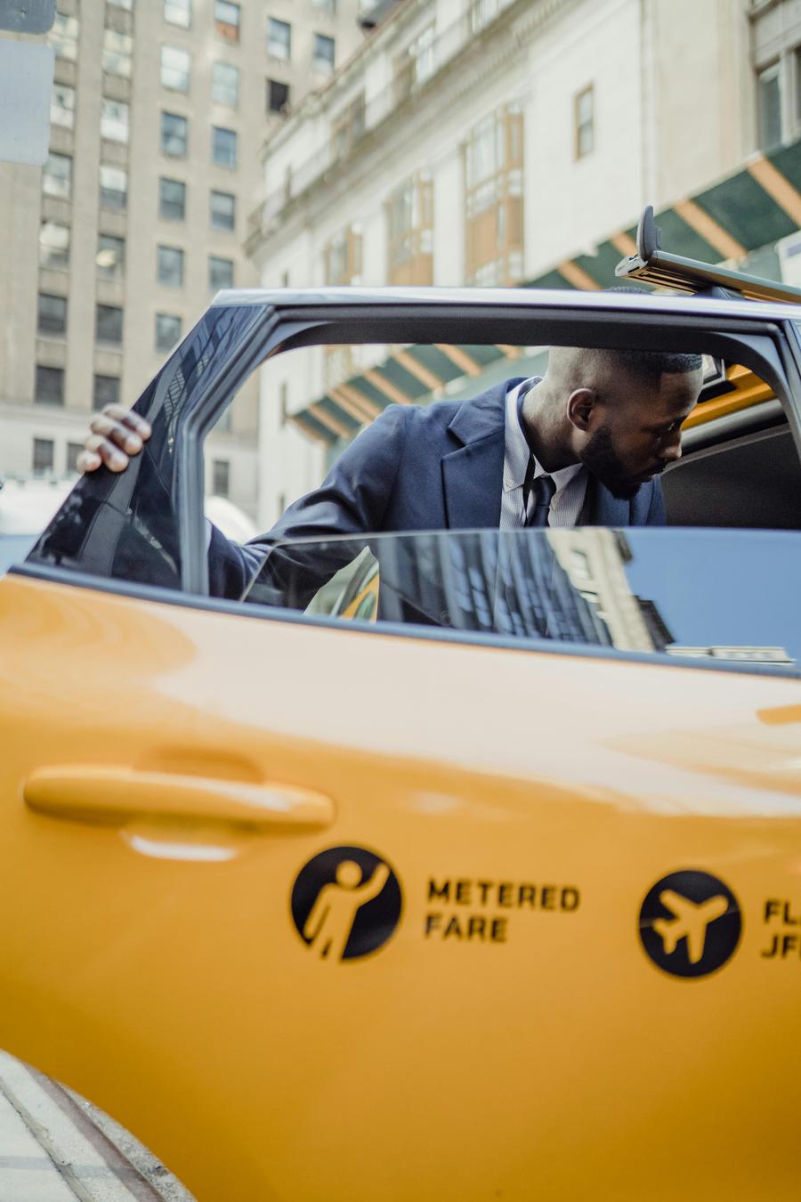 Passenger entering a QuickLyft vehicle